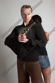OXANA AND XENIA STANDING POSE WITH GUNS 3 (9)